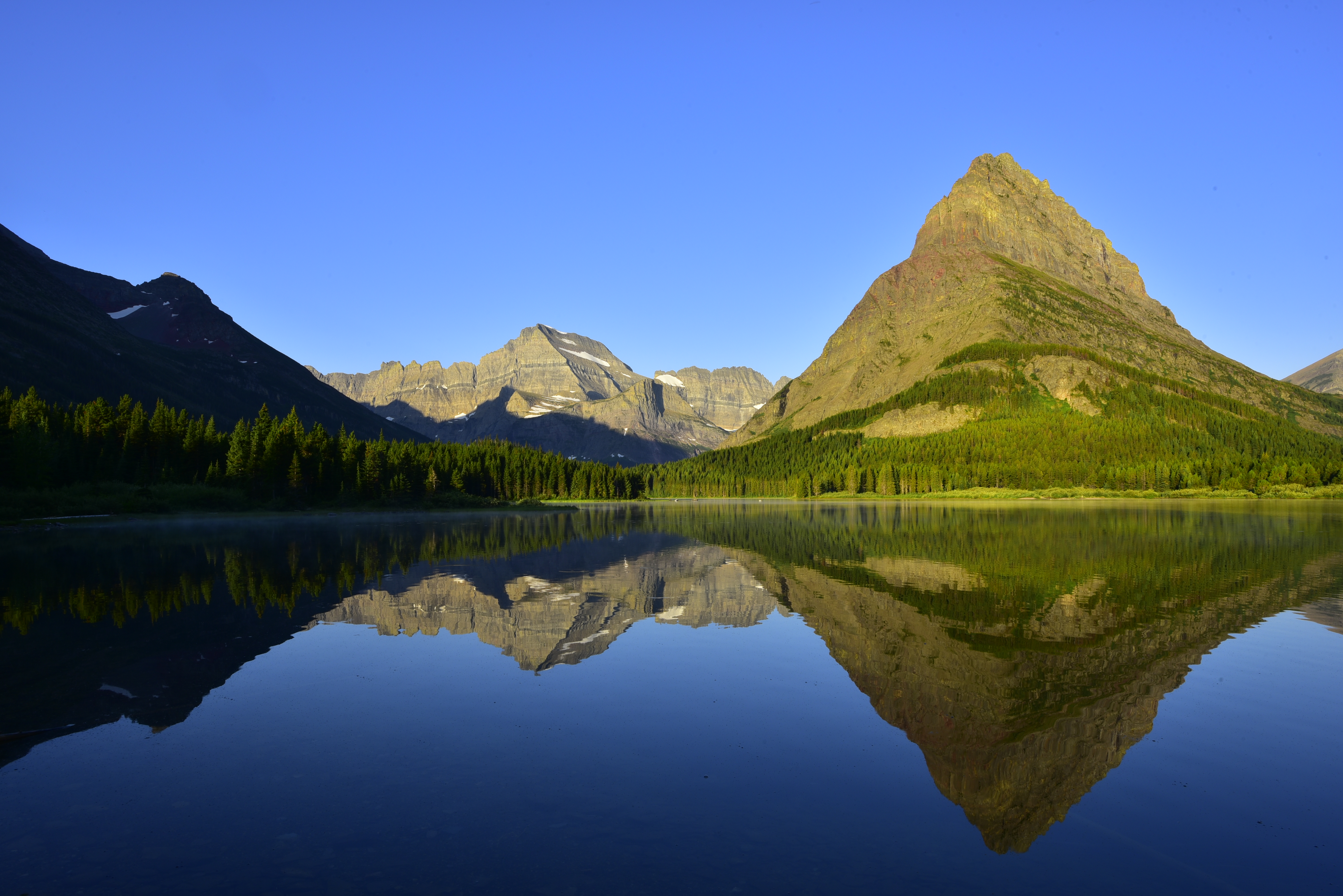 Early morning light, Swiftcurrent Lake, Mt. Gould (left), Grinnell Point (right)  -  Glacier National Park, Montana  