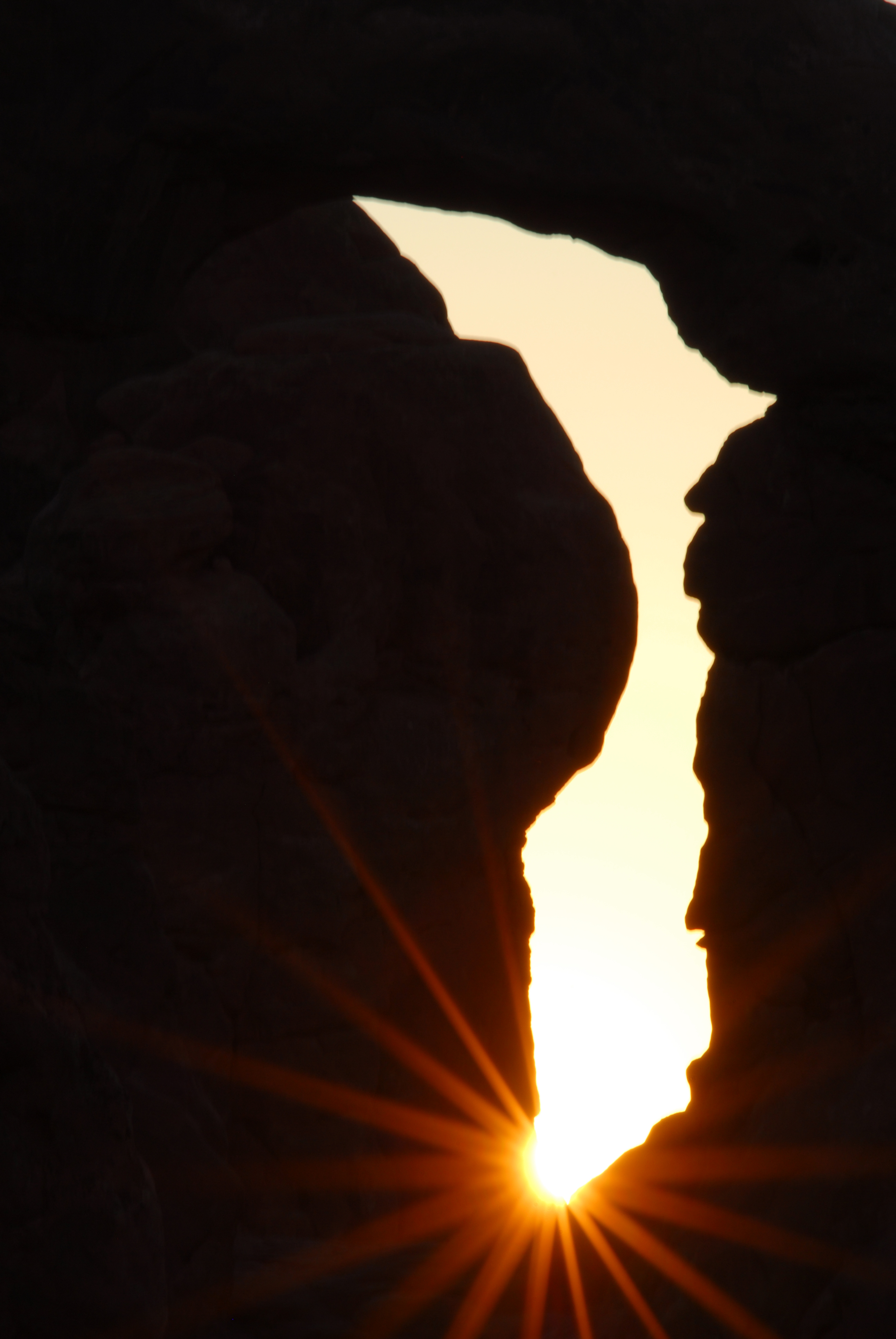 Sunstar through Turret Arch  -  Windows Section, Arches National Park, Utah  