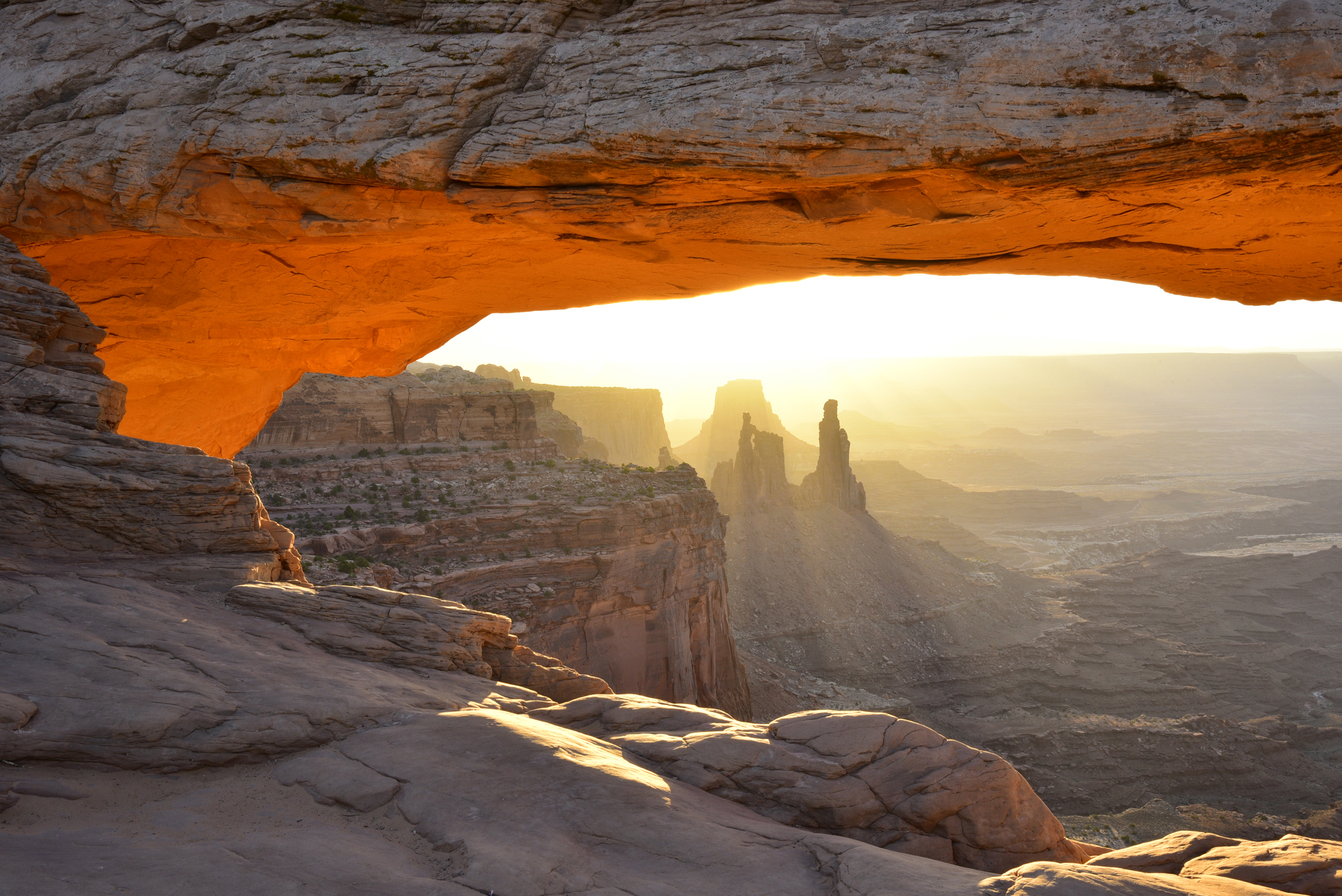 Early morning light at Mesa Arch with Washer Woman Arch and Monster Tower  -  Canyonlands National Park, Utah