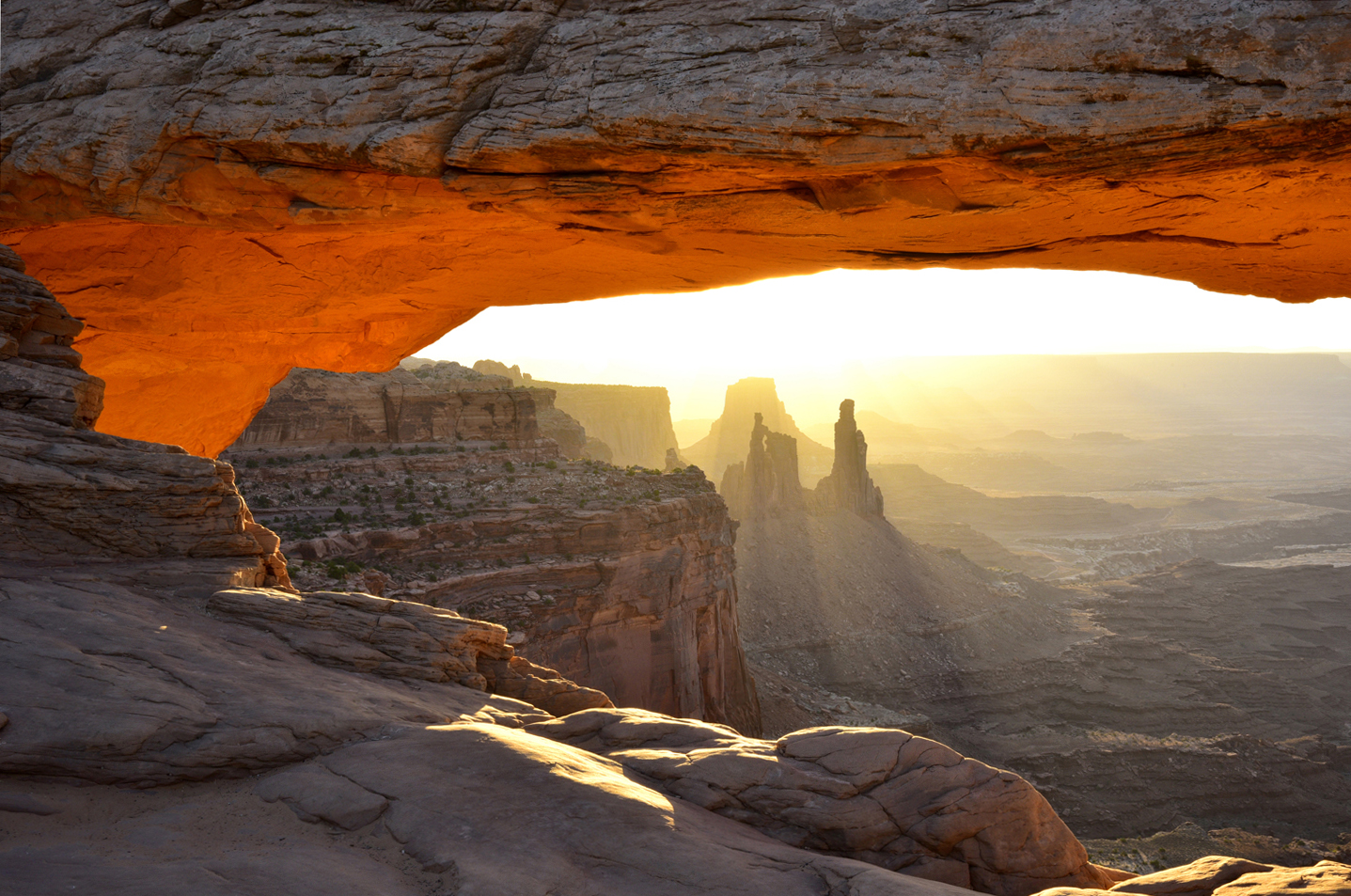 Early morning light at Mesa Arch with Washer Woman Arch and Monster Tower  -  Canyonlands National Park, Utah