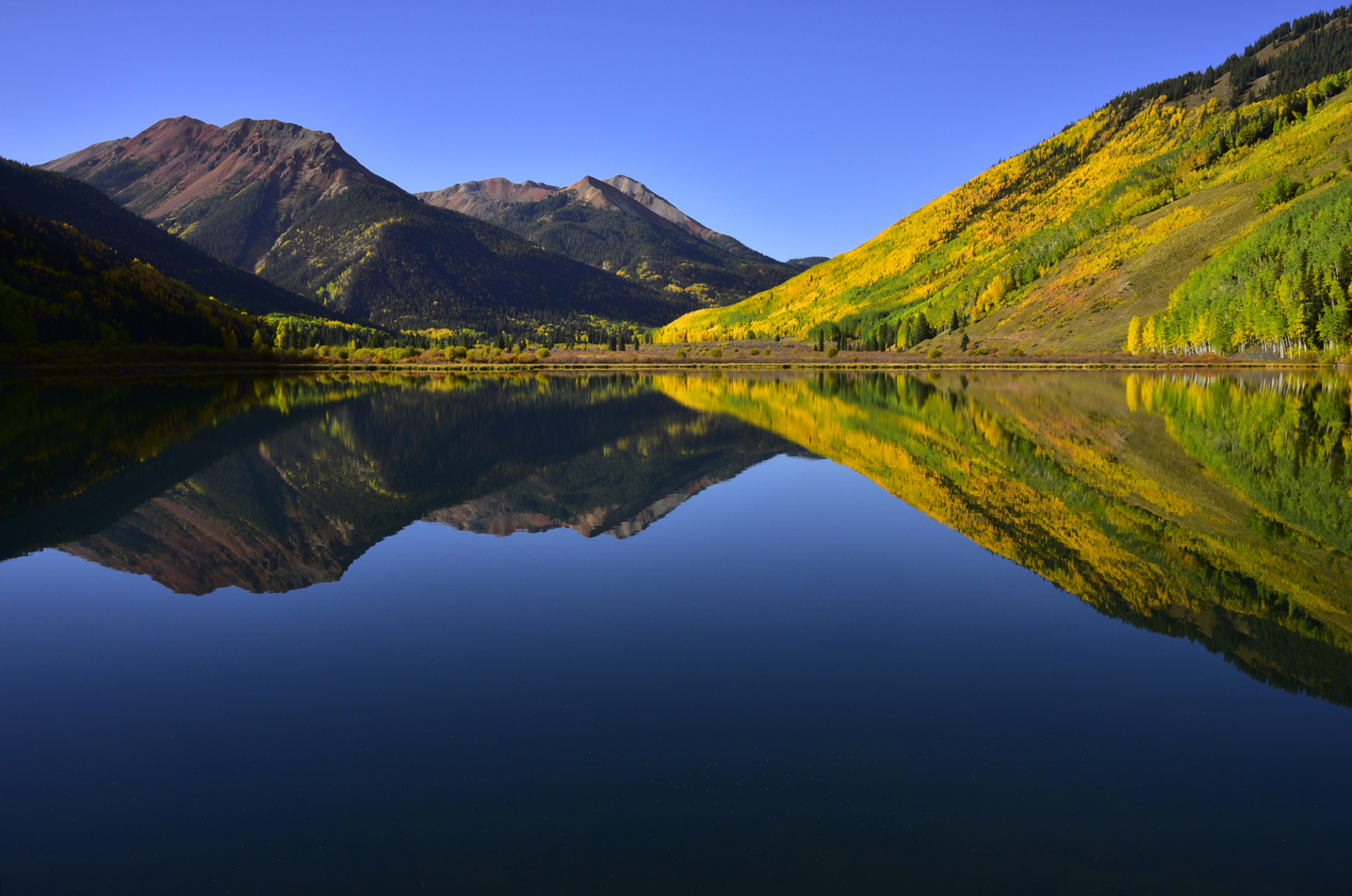 A near-perfect reflection in Crystal Lake  -  Uncompahgre National Forest, Colorado