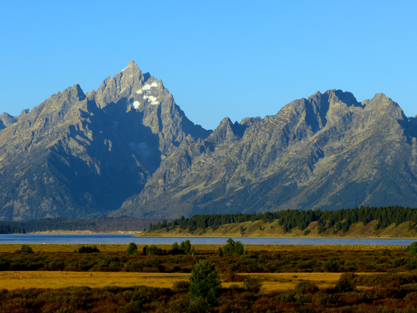 The Teton Range: Grand Teton (left) at 13,775 feet is the second highest peak in Wyoming   -  from Willow Flats Overlook, Grand Teton National Park, Wyoming