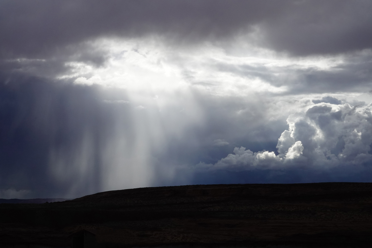 Rainstorm, interplay of clouds and light  -  The Chains, Glen Canyon National Recreation Area, Arizona --- Norman’s Note: “The Chains” is an area adjacent to the section of Lake Powell that is closest to the Glen Canyon Dam. The name comes from a chain of buoys that prevent watercraft from getting too close to the dam.