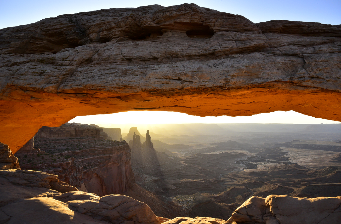 Early morning light at Mesa Arch, with Washer Woman Arch & Monster Tower -  Canyonlands National Park, Utah